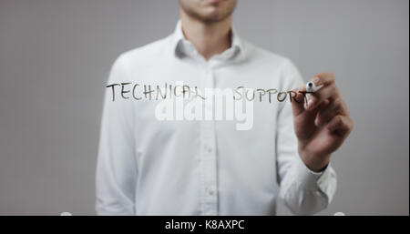 Technical support , Man Writing on Glass Stock Photo