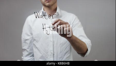 molecule , Man Writing on Glass Stock Photo - Alamy
