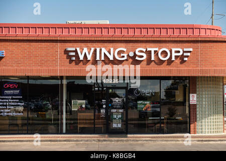 Wing Stop, exterior of a sports restaurant serving flavored wings Stock