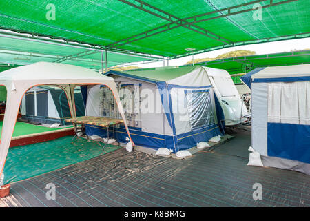 Caravan and tents at a camping in southern Spain set up as a