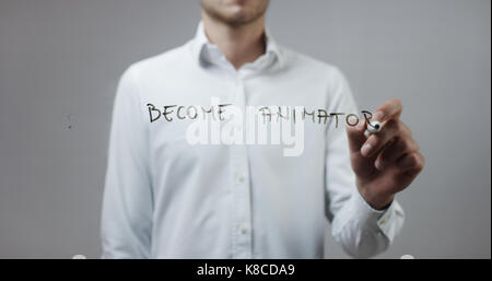 Become animator , Man Writing on Glass Stock Photo