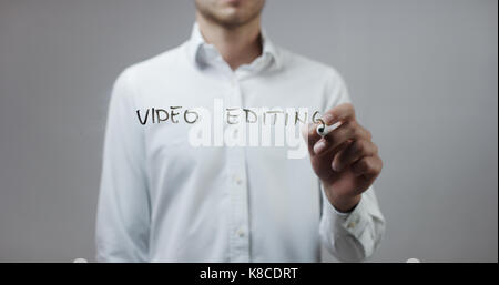 Video editing , Man Writing on Glass Stock Photo
