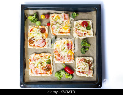 Homemade pizza sandwiches on a brown baking paper Stock Photo