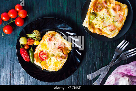 Homemade baked pizza sandwiches on a plate Stock Photo