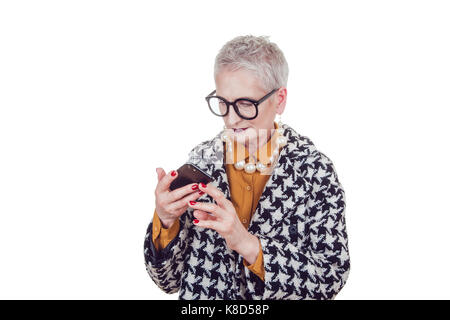 Stylish old woman in glasses using smartphone isoladed on white . Stock Photo