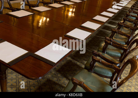 The long meeting table in the Locarno Room at the Foreign and Commonwealth Office (FCO), on 17th September 2017, in Whitehall, London, England. In 1925 the Foreign Office played host to the signing of the Locarno Treaties, aimed at reducing tension in Europe. The ceremony took place in a suite of rooms that had been designed for banqueting, which subsequently became known as the Locarno Suite. During the Second World War, the Locarno Suite's fine furnishings were removed or covered up, and it became home to a foreign office code-breaking department. Stock Photo