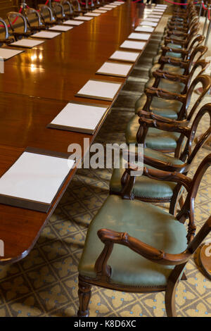 The long meeting table in the Locarno Room at the Foreign and Commonwealth Office (FCO), on 17th September 2017, in Whitehall, London, England. In 1925 the Foreign Office played host to the signing of the Locarno Treaties, aimed at reducing tension in Europe. The ceremony took place in a suite of rooms that had been designed for banqueting, which subsequently became known as the Locarno Suite. During the Second World War, the Locarno Suite's fine furnishings were removed or covered up, and it became home to a foreign office code-breaking department. Stock Photo
