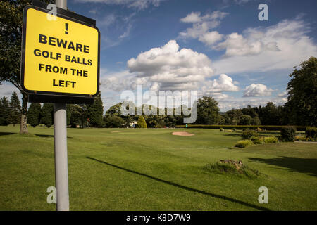 The 18th hole and green at Bingley St Ives Golf Club, at Harden, Bingley, Nr Bradford, Yorkshire, UK with a 'golf balls from the left' sign Stock Photo