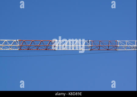 part of arm machinery construction crane with blue sky background Stock Photo