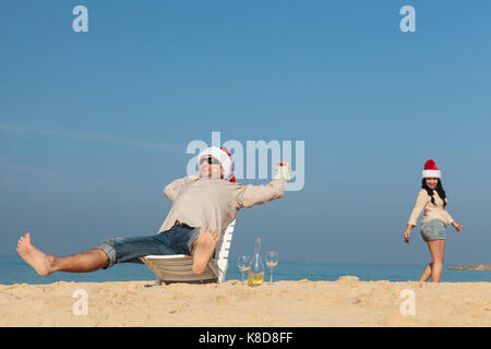 Christmas couple on a beach Stock Photo