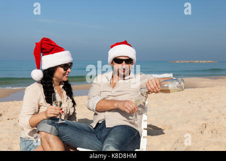 Christmas couple on a beach Stock Photo