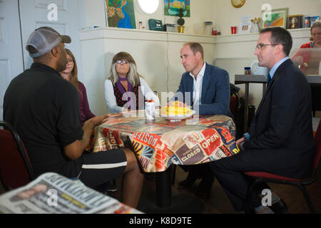 The Duke of Cambridge in the drop-in cafe which is geared toward the homeless, during his visit to the Spitafields Crypt Trust charity which provides a holistic recovery service to those dealing with complex drug and alcohol addictions, and often homelessness in Shoreditch, London. Stock Photo