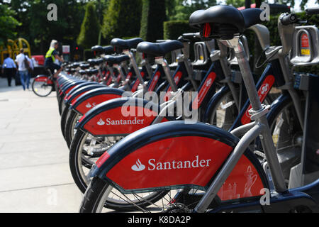 A row of Santander rental bikes parked in Hyde Park London Stock Photo