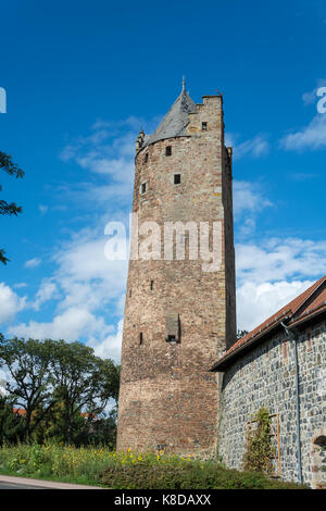 The grey tower as the oldest medieval fortified tower in Germany in the small German town Fritzlar Stock Photo