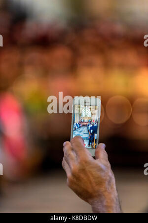 Close up of photograph of Bristol Cathedral interior being taken on mobile phone Stock Photo