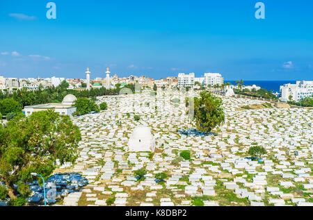 Aerial view of historic Sidi el-Mezeri cemetery with two minarets of Habib Bourguiba Mausoleum on the background, Monastir, Tunisia. Stock Photo