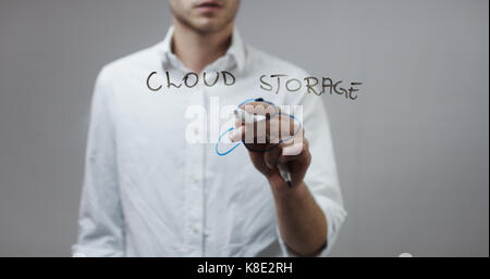 Cloud storage, Man Writing on Glass Stock Photo