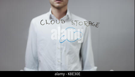 Cloud storage, Man Writing on Glass Stock Photo
