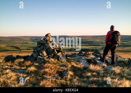 Hiker Enjoying the View North from the East Top of Bollihope Carrs, Weardale, County Durham UK. Stock Photo