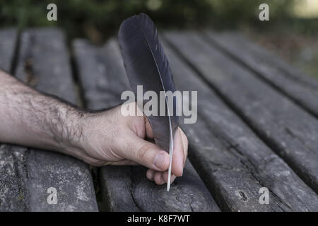 Hand writing with pen and inkwell Stock Photo