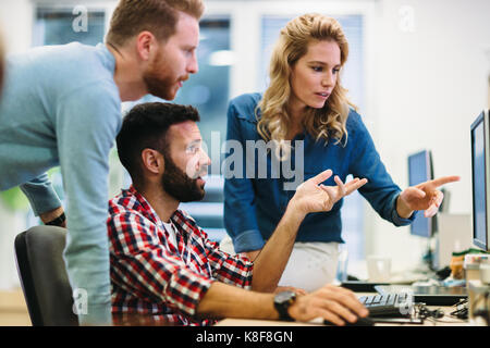 Software engineers working on project and programming in company Stock Photo