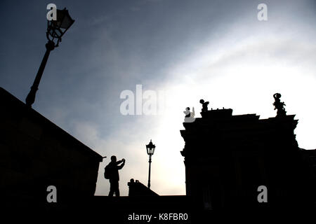 Dresden, Germany. 19th Sep, 2017. A tourist takes pictures at the Bruehl Terrace shrouded in heavy fog in Dresden, Germany, 19 September 2017. Credit: Arno Burgi/dpa-Zentralbild/ZB/dpa/Alamy Live News Stock Photo