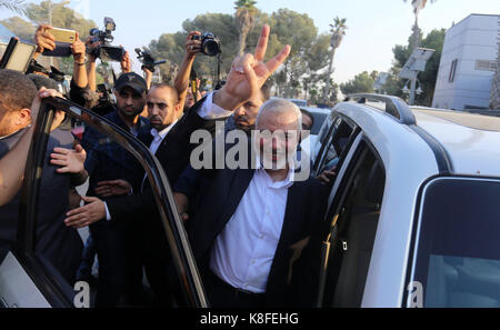 Rafah, Gaza Strip, Palestinian Territory. 19th Sep, 2017. Hamas Chief Ismail Haniyeh flashes the victory gesture upon his arrival on the Palestinian side of the Rafah border crossing, in the southern Gaza Strip on September 19, 2017. Haniyeh said on Tuesday evening that his movement is ready to receive the Palestinian Unity Government in Gaza during a press conference held immediately after returning to the Gaza Strip from Cairo, he said: 'To show Hamas' seriousness to bring about reconciliation, we invite the unity government to come and assume its duties in Gaza unimpeded (Credit Stock Photo