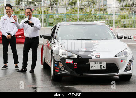 Tokyo, Japan. 19th Sep, 2017. Japanese automobile giant Toyota Motor president Akio Toyoda (R) and former F1 driver Kazuki Nakajima stand next to Toyota 86 sports car after they introduced Toyota's sports car series 'GR sports' from Gazoo racing at Toyota's showroom Megaweb in Tokyo on Tuesday, September 19, 2017. GR series are sports tuned Toyota's vehicle and seven models are started to sell from September 19 through Toyota's shops. Credit: Yoshio Tsunoda/AFLO/Alamy Live News Stock Photo