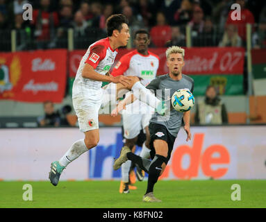 Augsburg, Germany. 19th Sep, 2017. Augsburg's Koo Ja-cheol (Front) controls the ball during a German Bundesliga match between FC Augsburg and RB Leipzig, in Augsburg, Germany, on Sept. 19, 2017. RB Leipzig lost 0-1. Credit: Philippe Ruiz/Xinhua/Alamy Live News Stock Photo