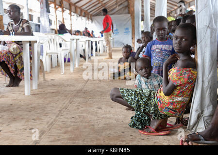 Imvepi, Uganda. 27th June, 2017. South Sudanese children wait to be registered as refugees at the refugee settlement in Imvepi, Uganda, 27 June 2017. More than two million people have fled the civil war in South Sudan, one million of them in Uganda. Credit: Gioia Forster/dpa/Alamy Live News Stock Photo