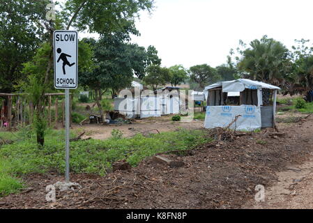 Imvepi, Uganda. 27th June, 2017. A sign reading 'Slow - School' can be seen at the refugee settlement in Imvepi, Uganda, 27 June 2017. More than two million people have fled the civil war in South Sudan, one million of them in Uganda. Credit: Gioia Forster/dpa/Alamy Live News Stock Photo