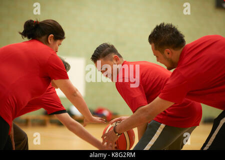 Students playing basketball Stock Photo