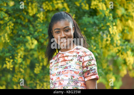 Portrait of young woman looking at camera smiling Stock Photo