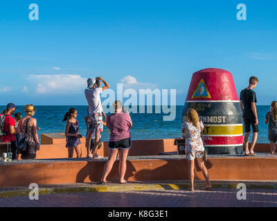 People taking pictures at The Southernmost Point Buoy in Key West Florida is the southernmost point in the continental United States Stock Photo