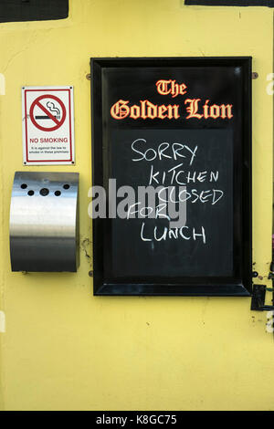 Signage - a strange sign on the wall of a public house. Stock Photo