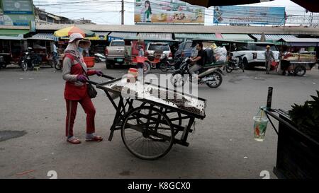 Lady with a Push Cart Selling Shel fFsh Serei Sophon Sisophn Bus Station Transportation Hub Cambodia Third World Developing Country Stock Photo