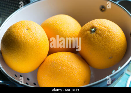 A bowl with a couple of oranges from above Stock Photo