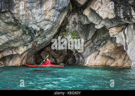 Man kayaking around marble caves, Puerto Tranquilo, Aysen Region, Chile, South America Stock Photo