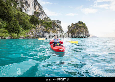 Man kayaking on General Carrera Lake, Puerto Tranquilo, Aysen Region, Chile, South America Stock Photo