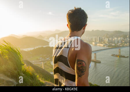Man looking at view during sunset, Rio de Janeiro, Brazil Stock Photo