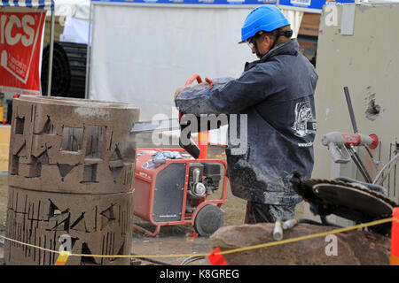 HYVINKAA, FINLAND - SEPTEMBER 8, 2017: Man cuts precise openings in concrete in a work demonstration of ICS chain saw on Maxpo 2017. Stock Photo