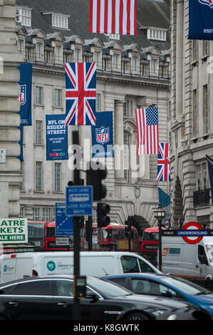 NFL on Regent Street hanging banners above traffic in central London. Stock Photo