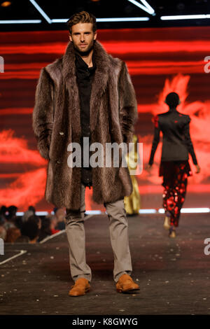 Montreal,Canada 23/08/2017 A model wearing a fur coat poses on the runway at the fashion show held during the Fashion and Design Festival. Stock Photo