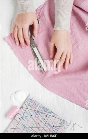 Female hands holding the scissors Stock Photo