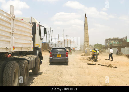 Vehicles drive down Enterprise Road whilst under construction, Nairobi, Kenya Stock Photo