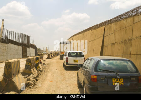 Vehicles drive down Enterprise Road whilst under construction, Nairobi, Kenya Stock Photo