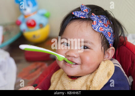 BABY EATING Stock Photo