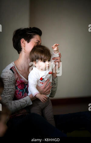 PARENT AND CHILD PRACTICING YOGA Stock Photo