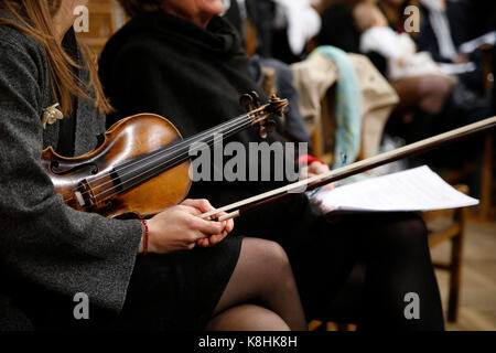 Violin player in a church. france.
