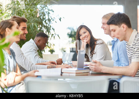 Interracial team of students work group session in school Stock Photo